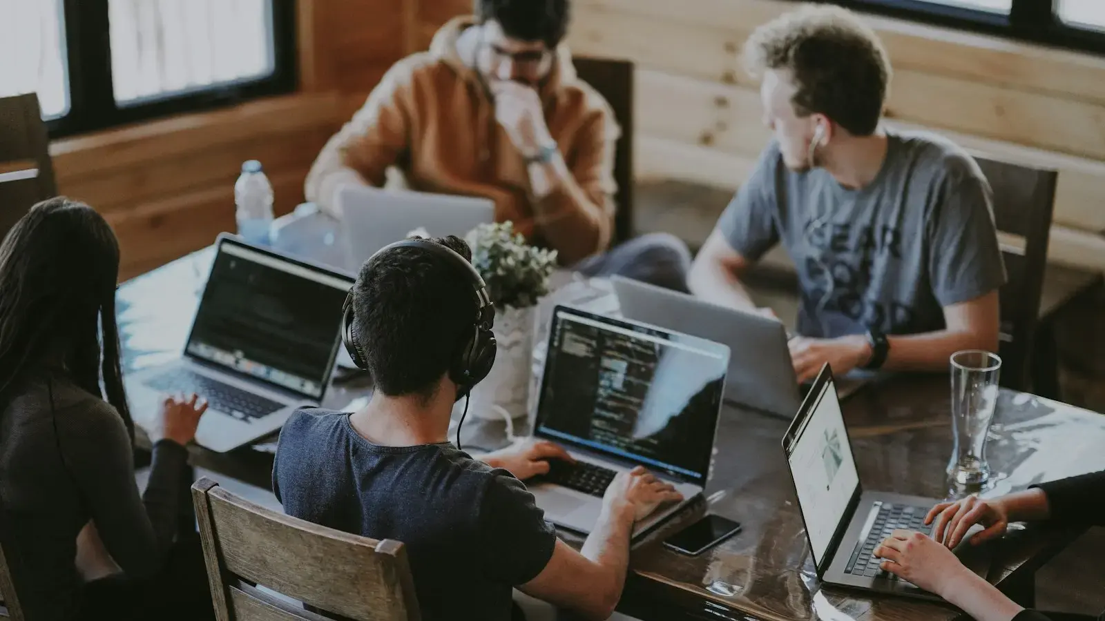 IT support team working at computers in a modern office